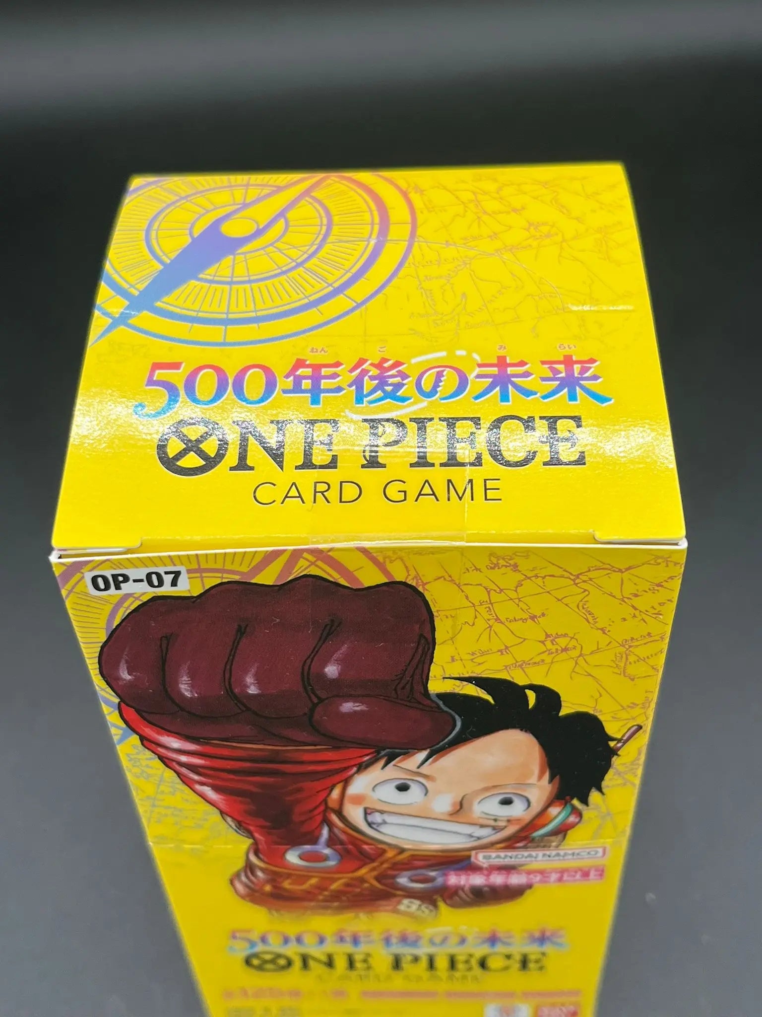 Top view of sealed One Piece Card Game Display OP-07, Japanese version
